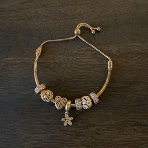 Pandora rose gold adjustable bracelet with 7 charms
